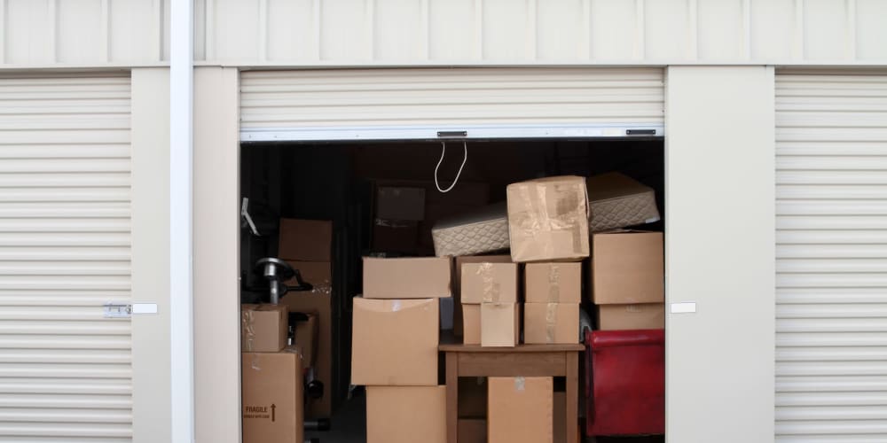 boxes in an open storage unit at Trojan Storage of Shoreline in Shoreline, Washington