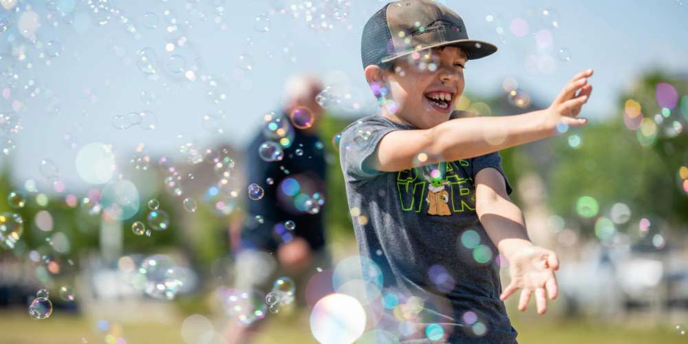 Boy playing with bubbles at BB Living Wellen Park in Venice, Florida
