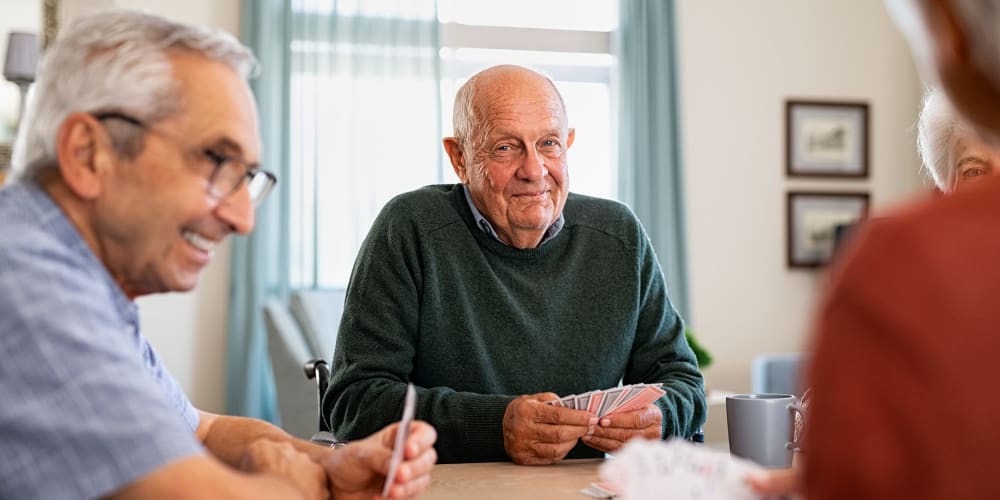 guys playing cards  at Vista Prairie Communities, Champlin, MN