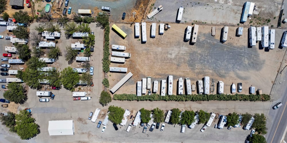 many rvs parked outside from above at Comstock RV Park and Storage in Mound House, Nevada