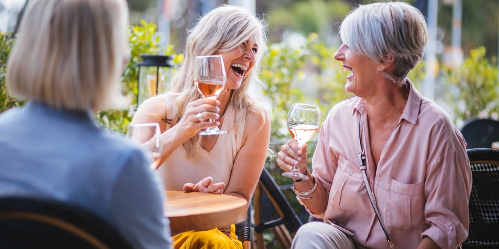 Residents of The Atwater having a glass of wine at one of the local Nocatee restaurants.