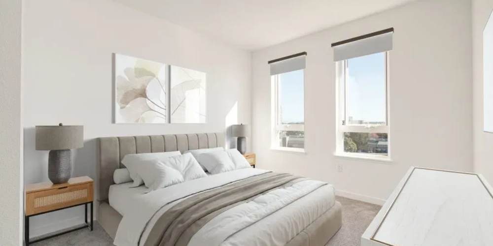 Cozy bedroom with window at 353 Main Street Family Apartments in Redwood City, California