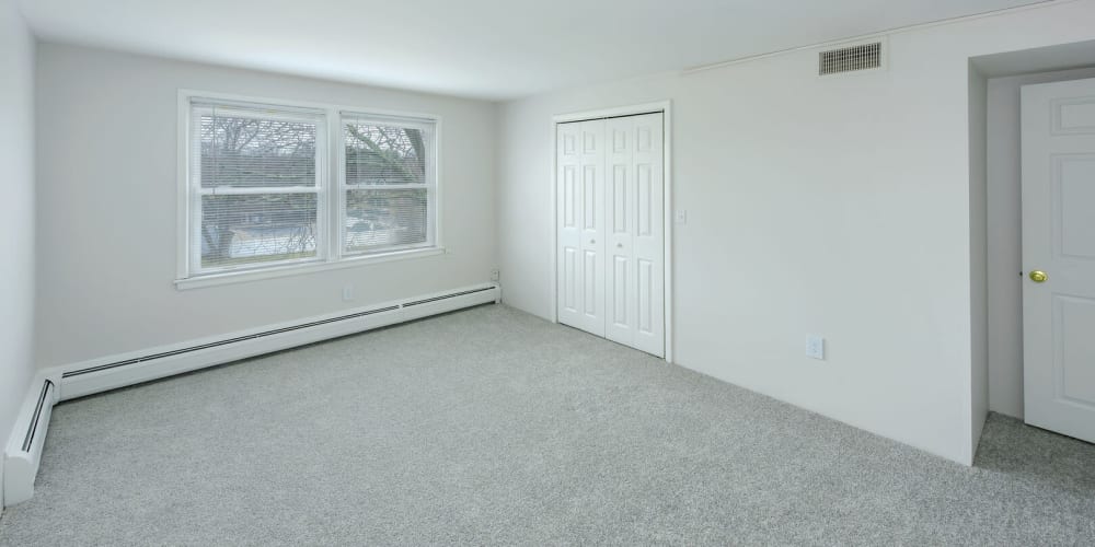 Secondary carpeted bedroom at The Four Seasons Apartments in East Providence, Rhode Island