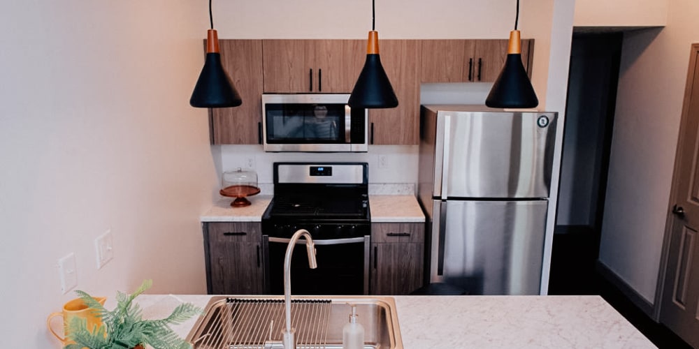 Apartment kitchen with stainless steel appliances at The Laurel Flats in Crawfordsville, Indiana