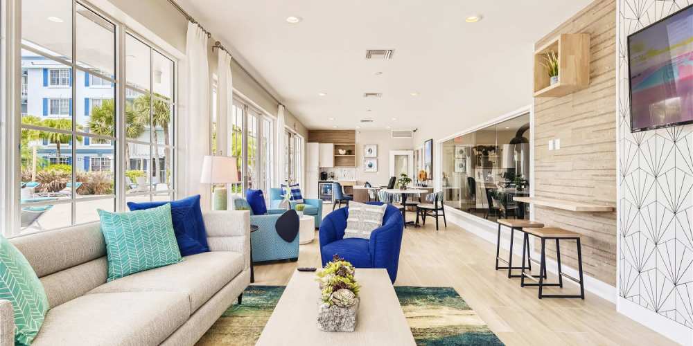 Resident clubhouse with comfy sofas at Bermuda Cay in Boynton Beach, Florida
