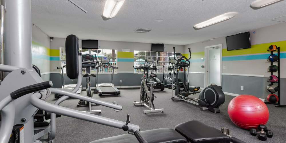 Community fitness center with weight machines at Central Place at Winter Park in Winter Park, Florida