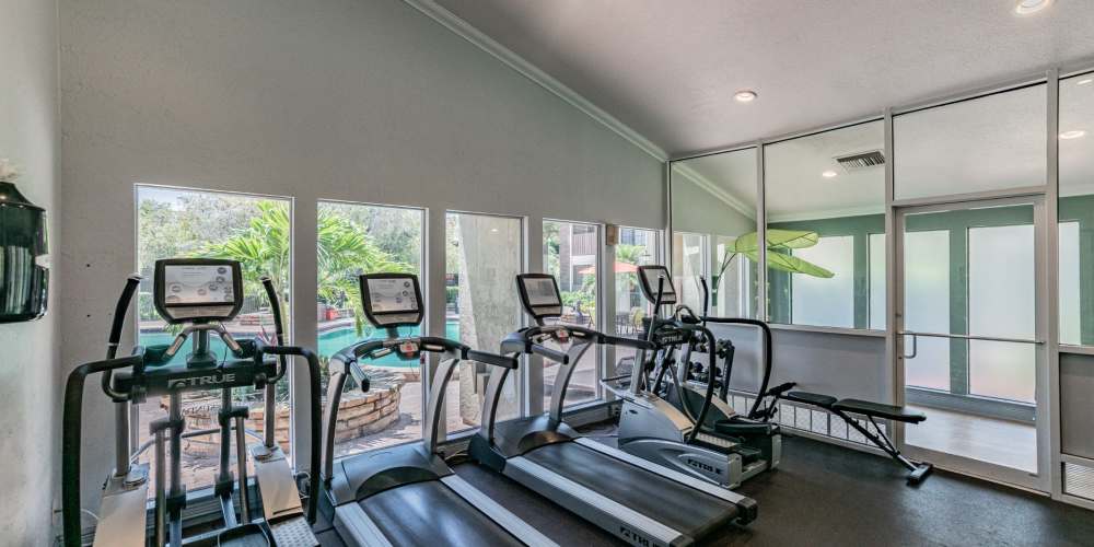Community fitness center with treadmills at Legend Oaks in Tampa, Florida