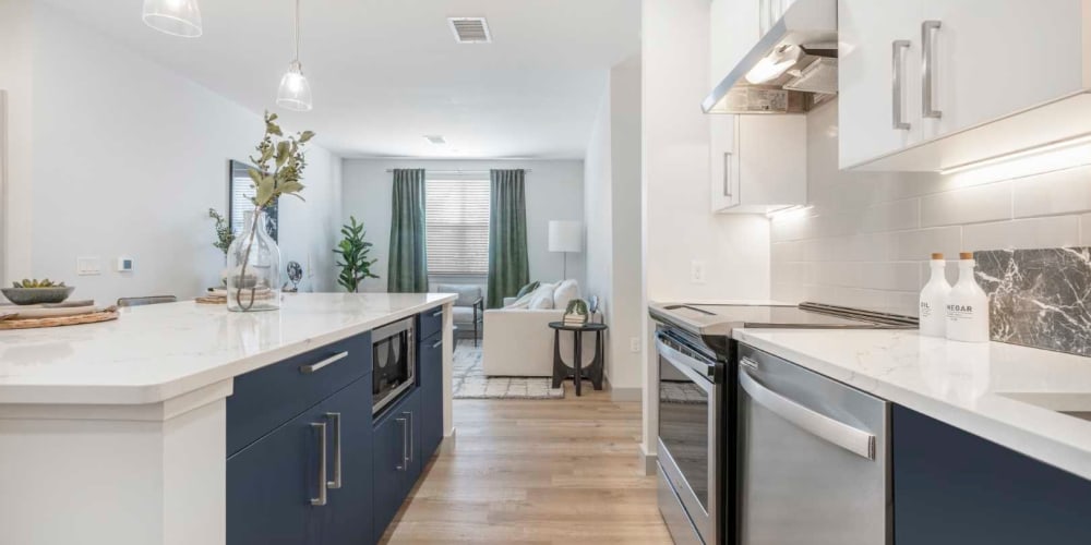 Apartment kitchen with stainless steel appliances at The Val in Billerica, Massachusetts