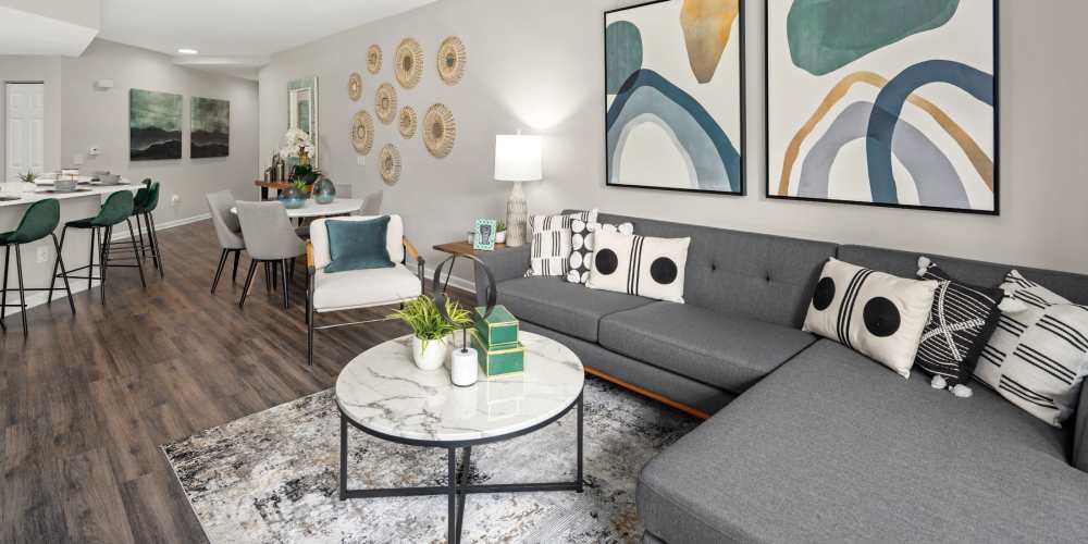 Spacious apartment living room with sectional sofa at Pointe Parc at Avalon in Orlando, Florida