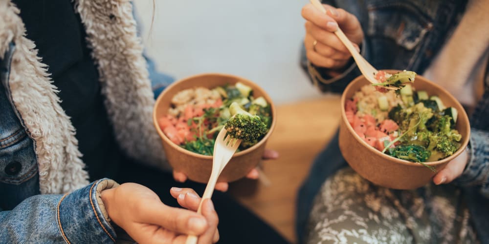 Residents having fresh bowls from a cafe near Parkway Apartments in Fremont, California