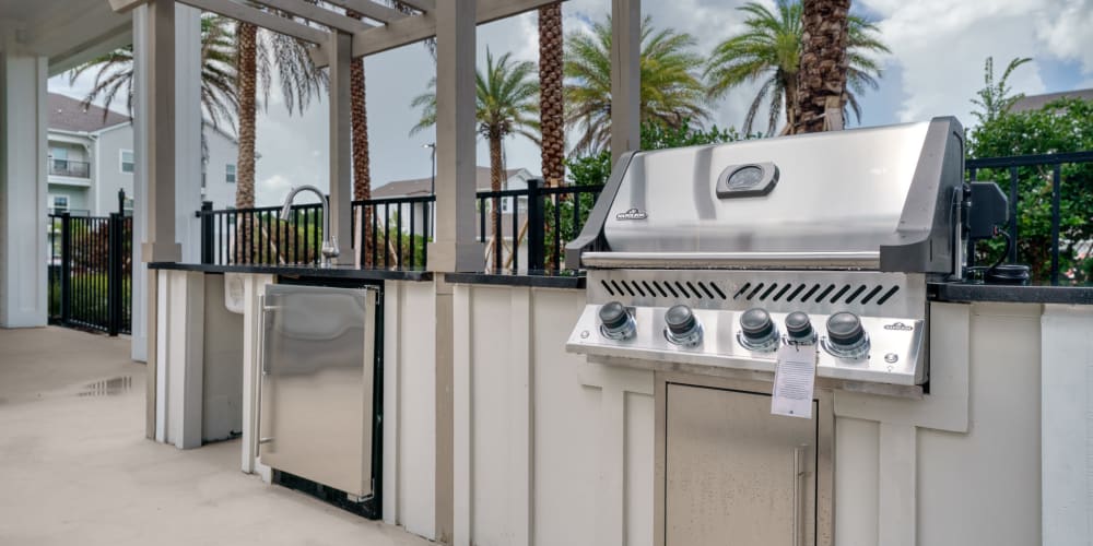 A grilling station near the swimming pool at The Station at Fleming Island in Fleming Island, Florida