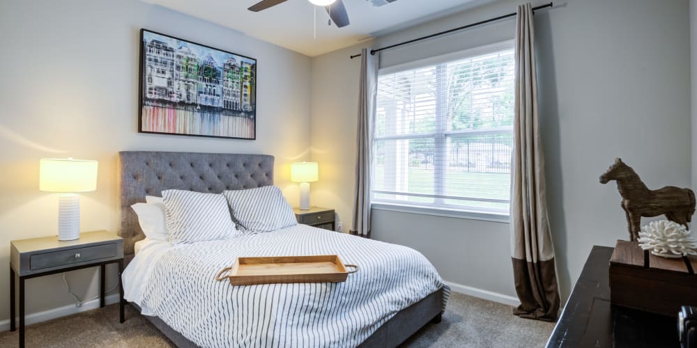 A furnished apartment bedroom at North Hills at Town Center in Raleigh, North Carolina