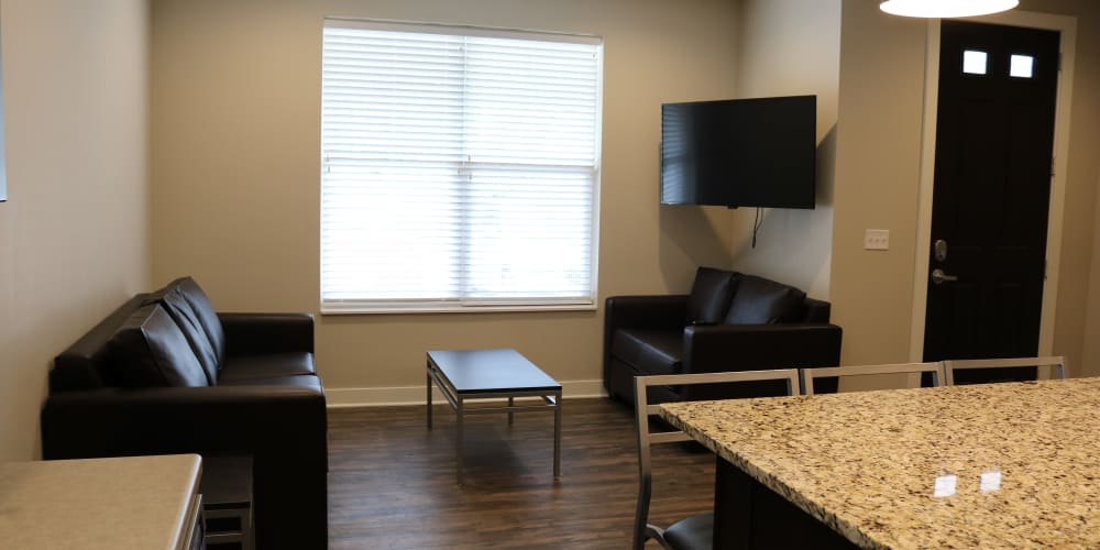 Living room area at The Quarters at East Lansing Cottages in East Lansing, Michigan
