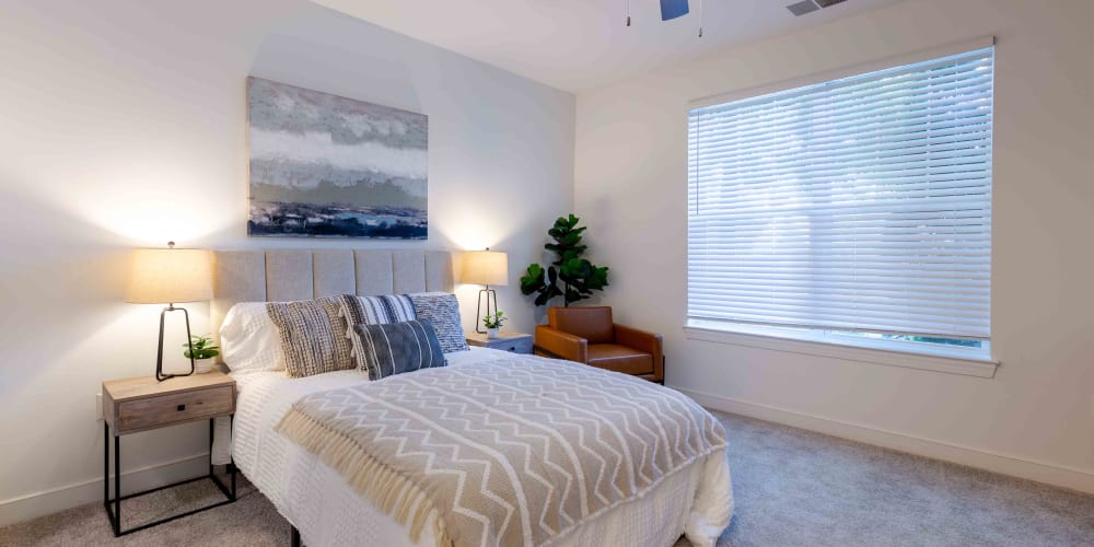 A main bedroom with an attached bathroom at Spring Water Apartments in Virginia Beach, Virginia