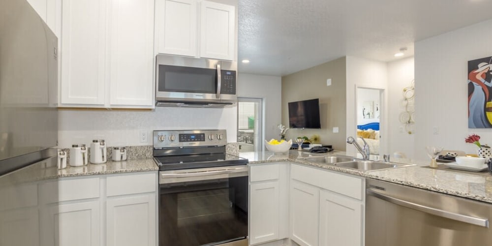 Kitchen with stainless-steel appliances at The Deco at Victorian Square in Sparks, Nevada