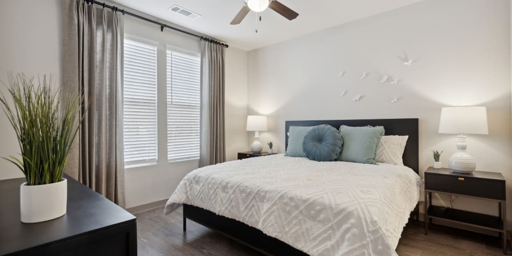Master bedroom with ceiling fan at Radius Wolf Ranch in Georgetown, Texas