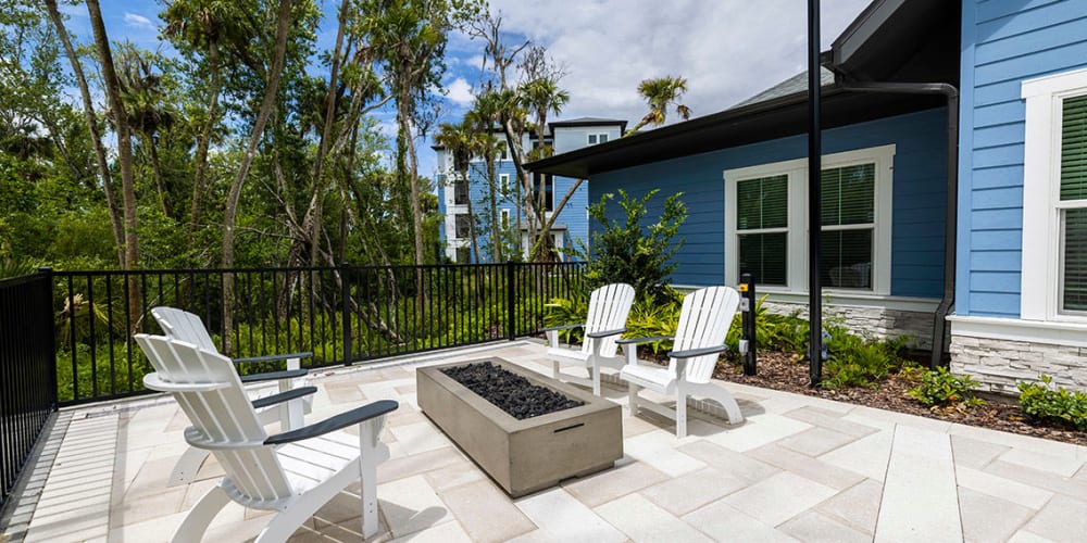 Fireside seating in an outdoor hangout are at Integra Trails in Cocoa, Florida