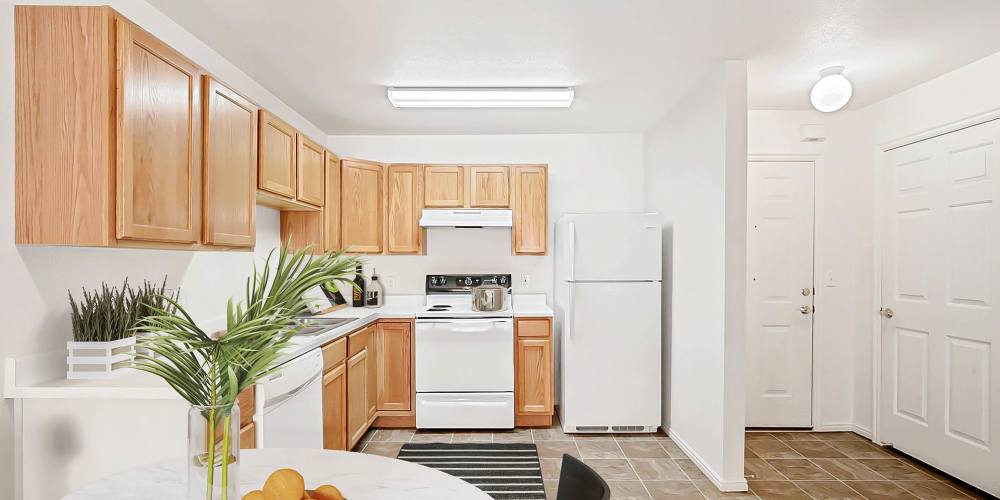 Kitchen with appliances at Rose Cove Apartment Homes in Farmington, Utah