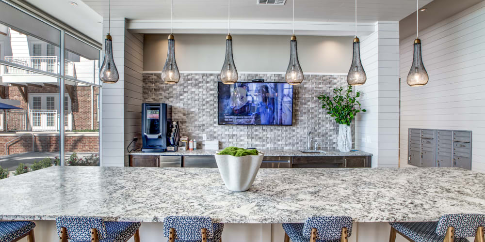 TV and bar seating at 255 Assay in Houston, Texas