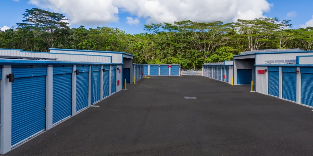 Drive-up storage units with wide drive aisles at StorQuest Self Storage in Kea'au, Hawaii