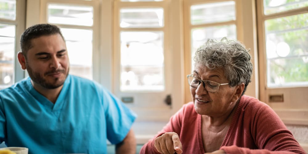 Resident talking with a nurse at Barclay House of Aiken in Aiken, South Carolina
