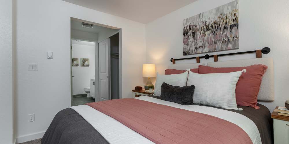 Model bedroom with a large bed at Terra @ Monroe in Monroe, Washington