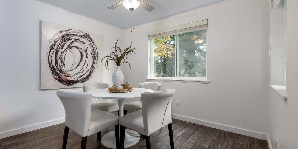 Apartment dining room with a table set for four at Terra @ Monroe in Monroe, Washington