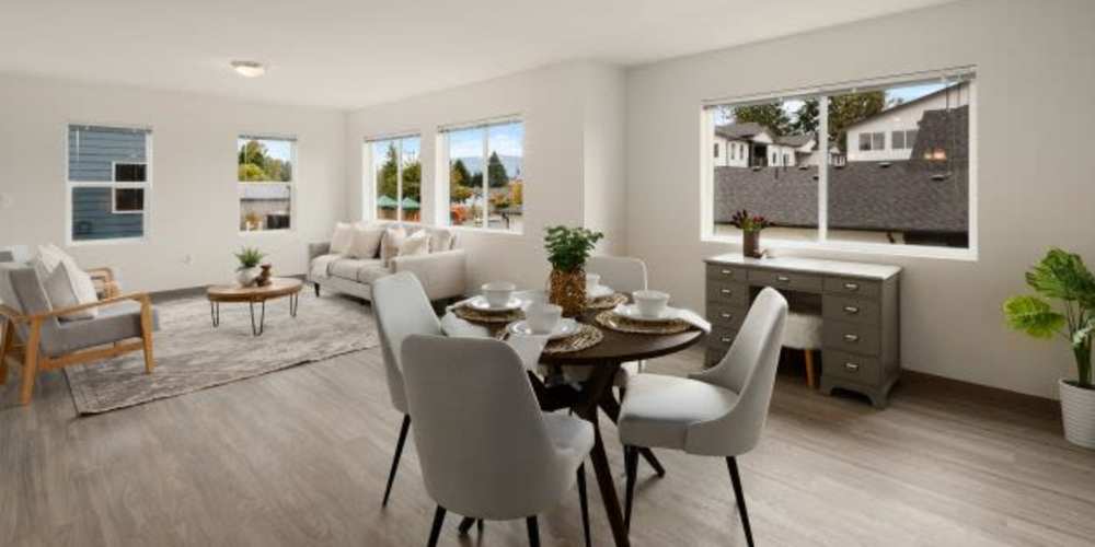 Open floor plan apartment living and dining room at Four Pines Apartments in Burlington, Washington