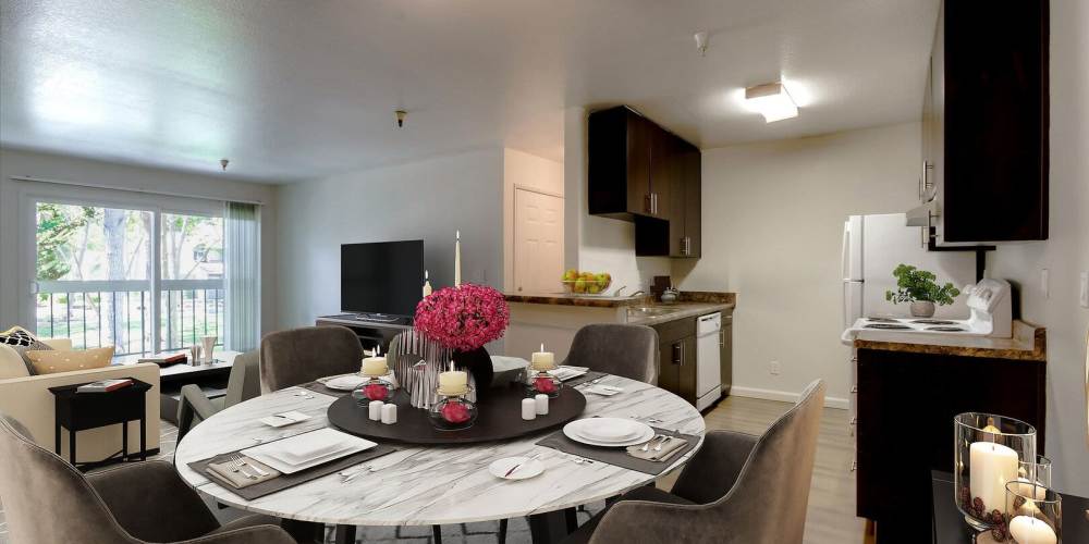 Furnished apartment with kitchen, dining area, and living room at Terman Apartments in Palo Alto, California