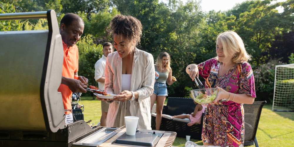 Residents grilling food near Evergreen Park Townhomes and Apartments in Lansing, Michigan