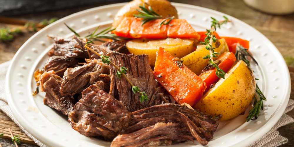 A plate full of meat, potato's and carrot at The Barclay in Charlottesville, Virginia