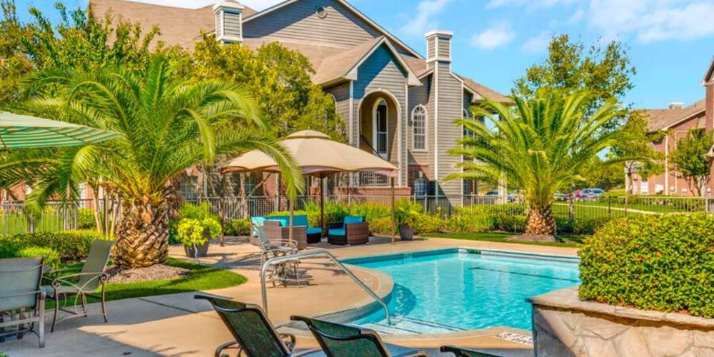 Lounge chairs by the pool at Augusta North in Houston, Texas