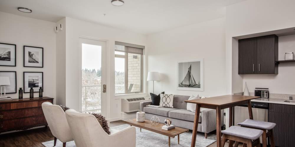 Living room with scenic views next to the kitchen at Green Leaf Uptown in Vancouver, Washington