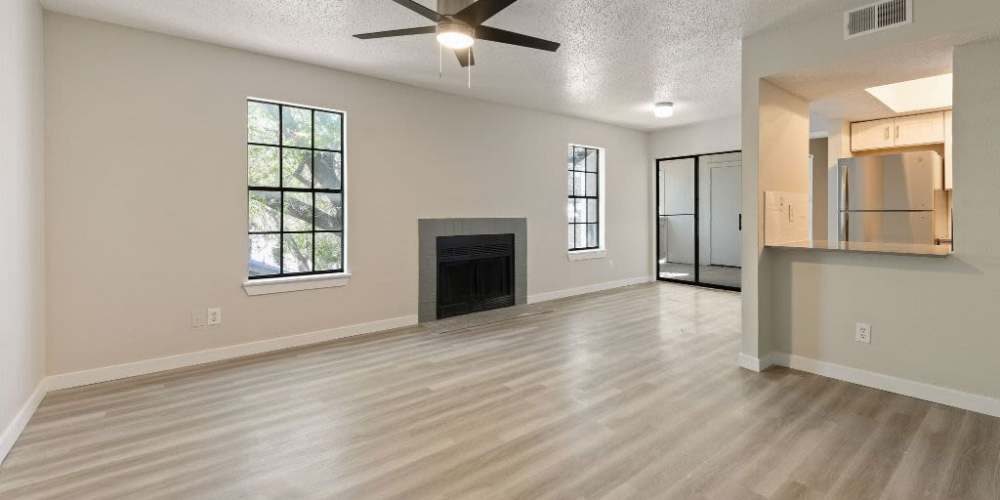 Comfortable living room in an apartment at Tides at Highland Meadows in Dallas, Texas