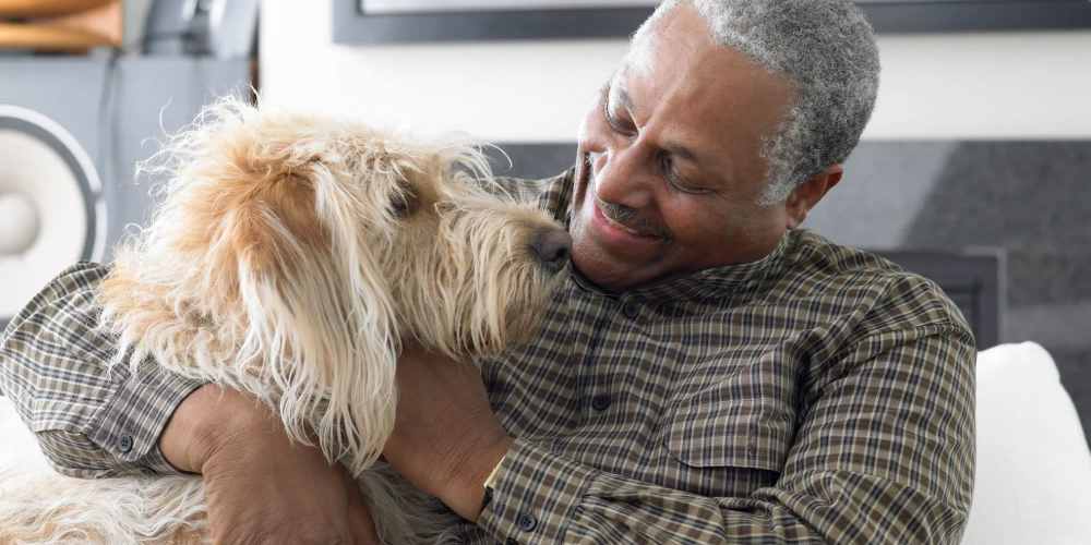 Resident playing with his dog at The Barclay in Charlottesville, Virginia