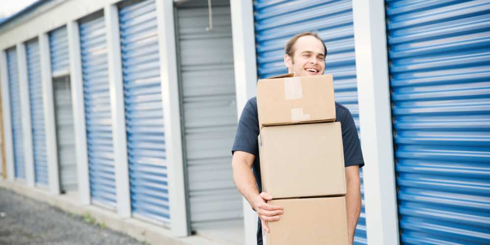 Customer carrying boxes at Key Storage in Wilder, Kentucky