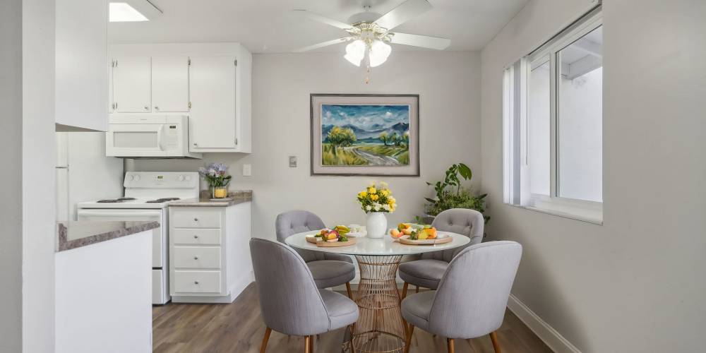 Wood-style flooring and door to the patio at Bayfair Apartments in San Lorenzo, California