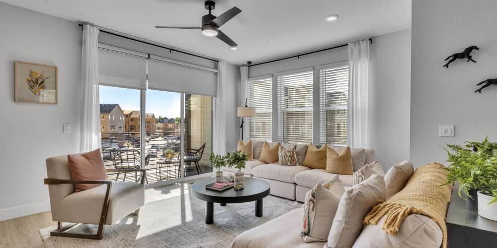 Living room featuring floor to ceiling windows & natural light 