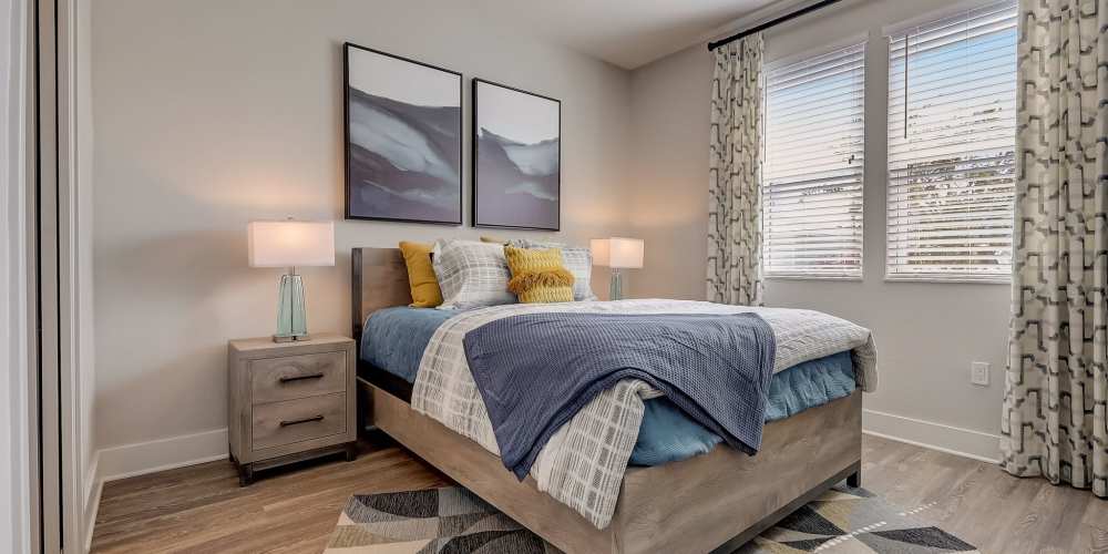 Cozy bedroom in a model home at Grande Pointe in Orlando, Florida
