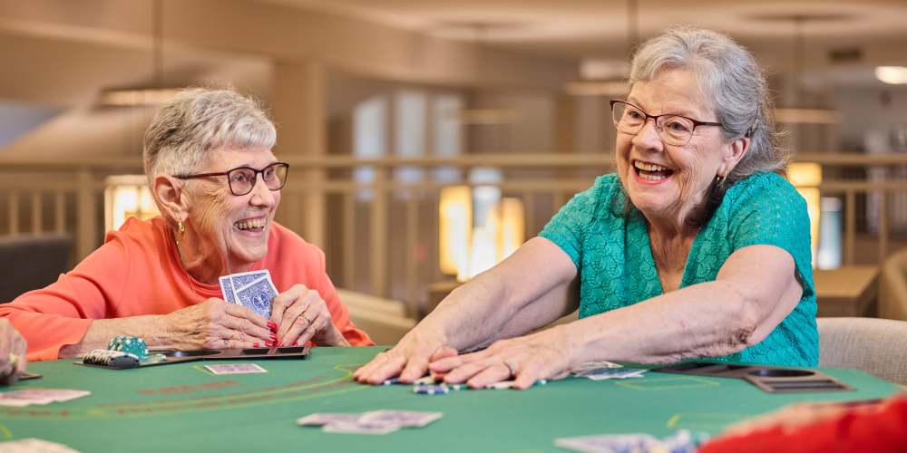 Residents playing poker at The Barclay at Sarasota in Sarasota, Florida