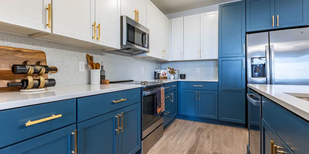 Modern kitchen with blue cabinetry at The Prospect in Charlotte, North Carolina