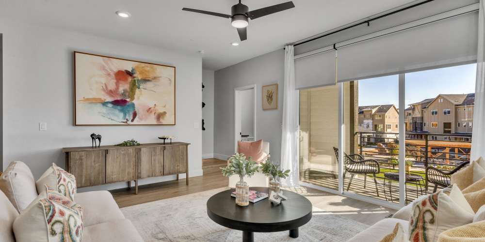 Living room with ceiling fan at BB Living Colliers Hill in Erie, Colorado