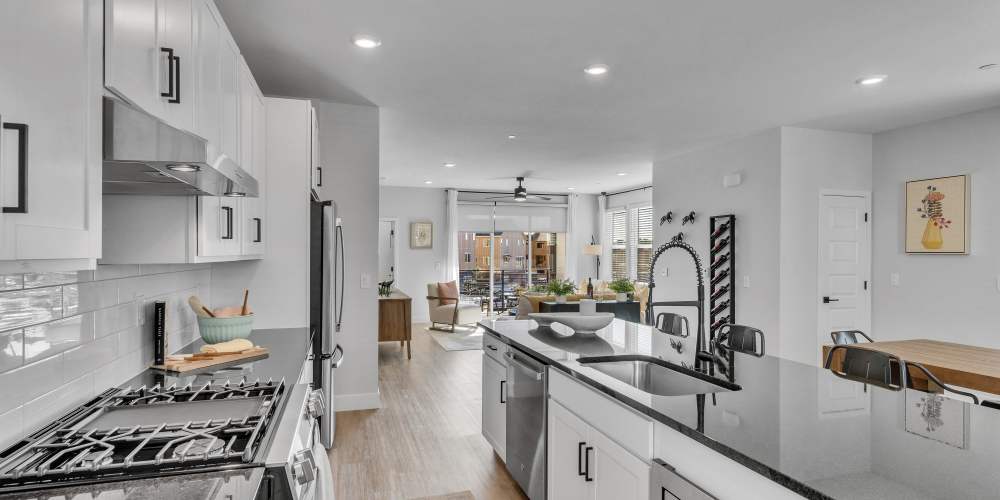 Modern kitchen with stove at BB Living Colliers Hill in Erie, Colorado