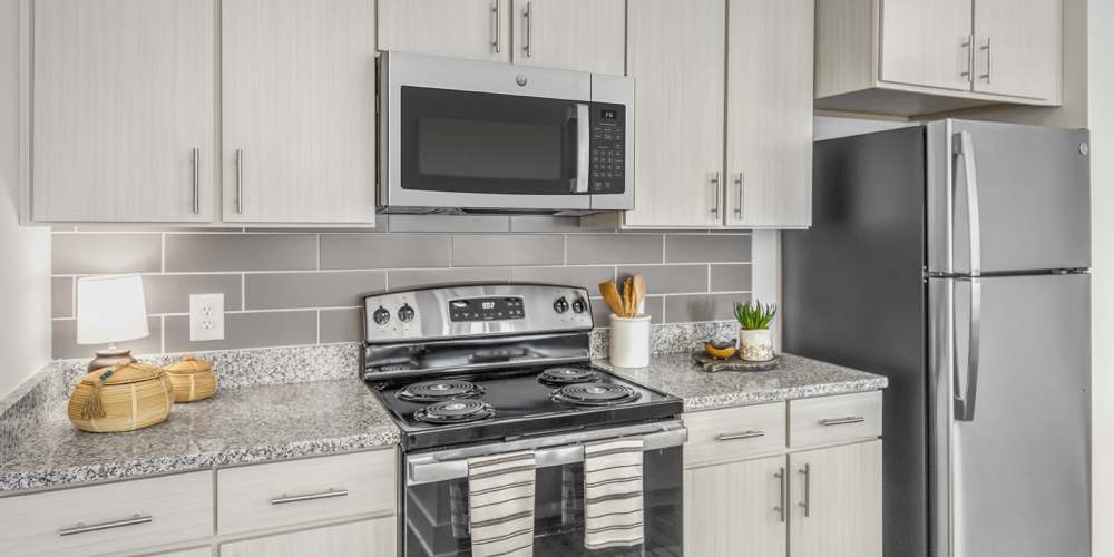 Apartment kitchen with stainless-steel appliances at Marlowe Place in Charlotte,North Carolina