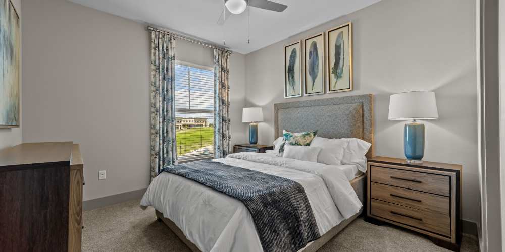 Bedroom with large window at Harbor Hill in Rockwall, Texas