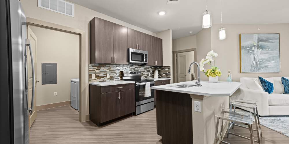 Kitchen with stainless steel appliance at Harbor Hill in Rockwall, Texas