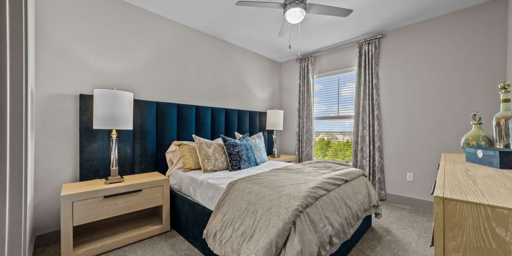 Bedroom with side lamps  at Harbor Hill in Rockwall, Texas