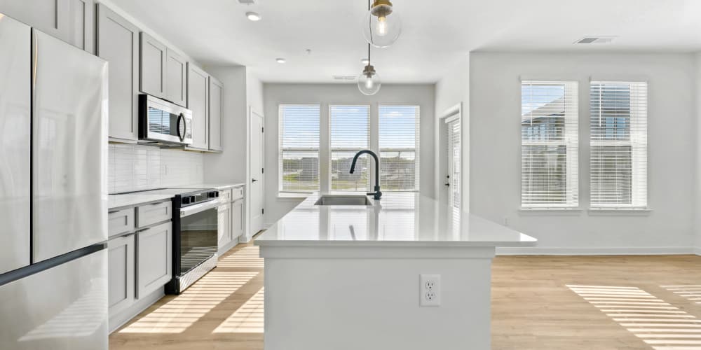 Rendering of modern kitchen with Samsung stainless-steel appliances at The Brook in Glen Allen, Virginia