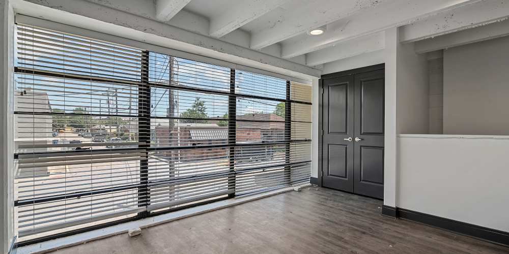 Floor-to-ceiling windows at The Lofts at the Municipal in Lafayette, Louisiana