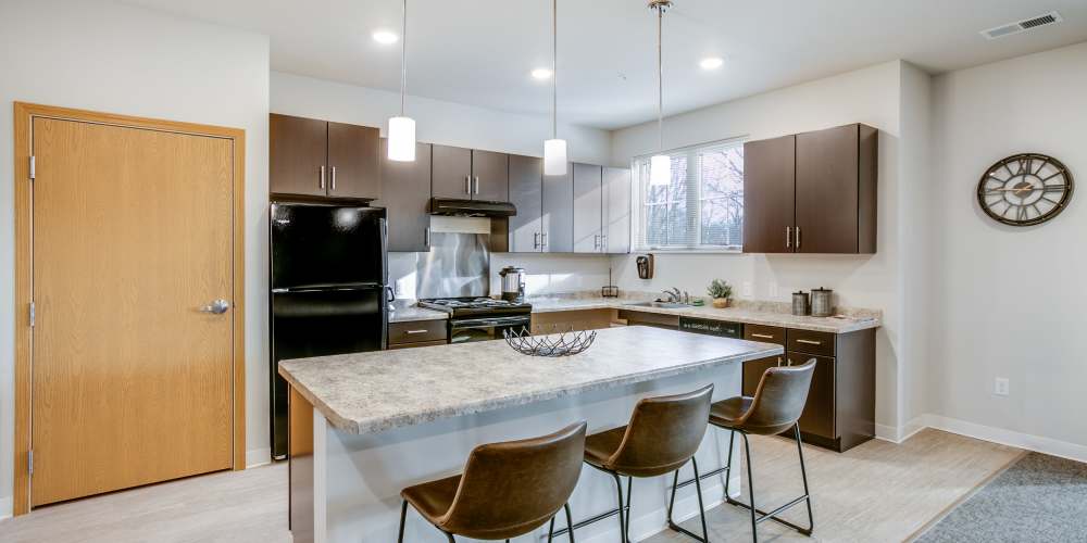 View of the kitchen and a breakfast counter at Whitetail Ridge in Salem, Wisconsin
